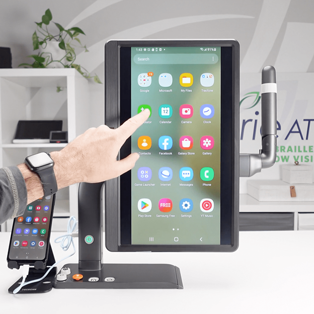Hand interacting with MirrorPad Pro displaying a magnified Android smartphone screen on the large 17.3-inch touchscreen for easier viewing and control through touch and swipes.