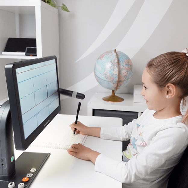 Student writing while using MirrorPad Pro's distance camera facing the table top to magnify lined paper on a large screen, supporting handwriting and close-up tasks.